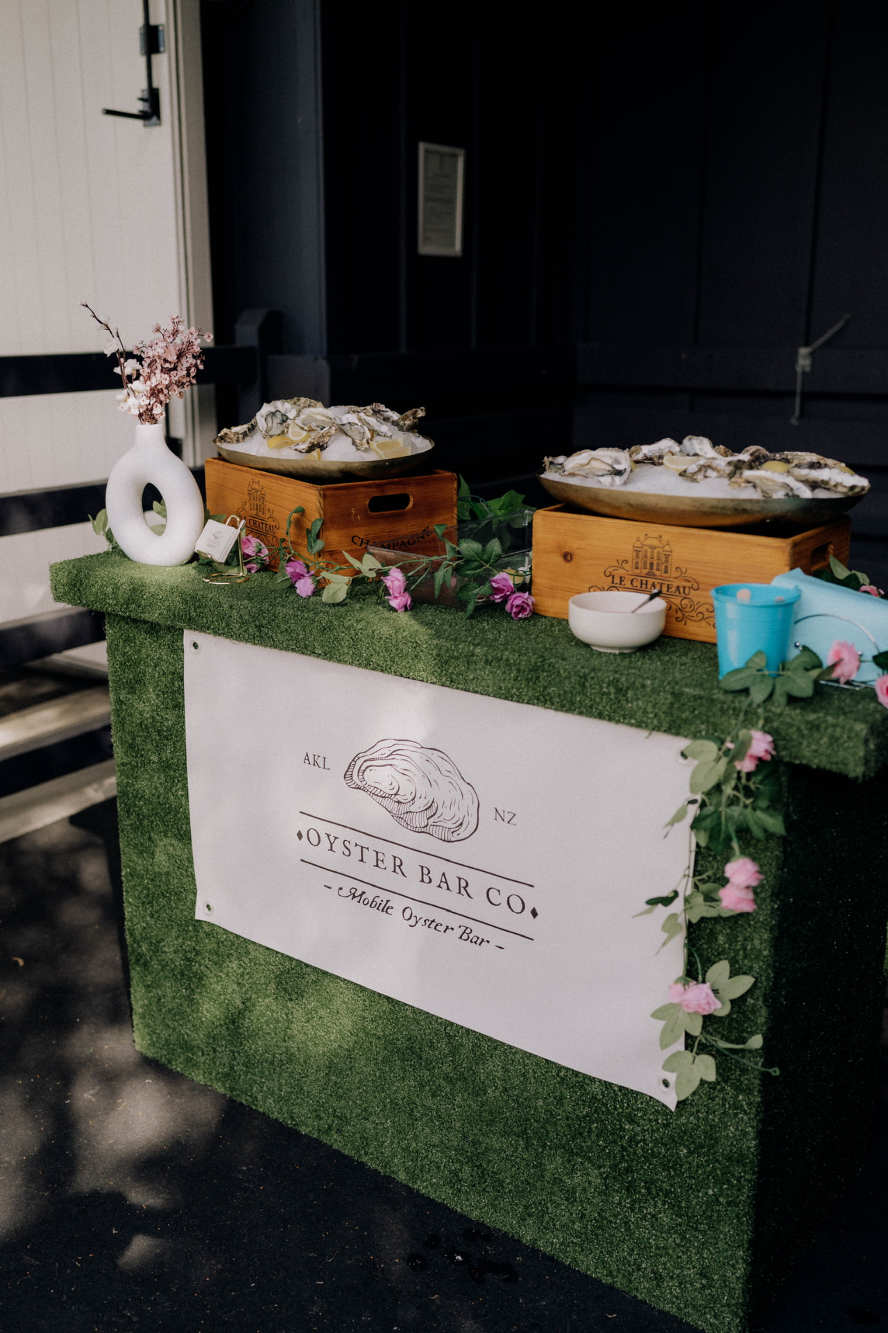 The Oyster Bar Co. mobile oyster bar set up with platters of freshly shucked oysters